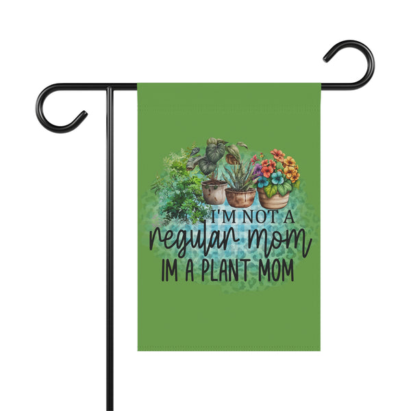 Garden flag with plant-themed design and text on a green background