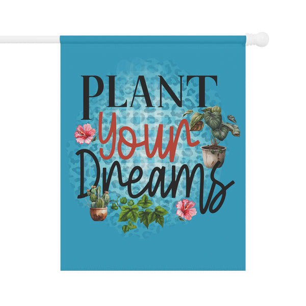 Decorative flag with 'Plant Your Dreams' text and plant illustrations on a blue background