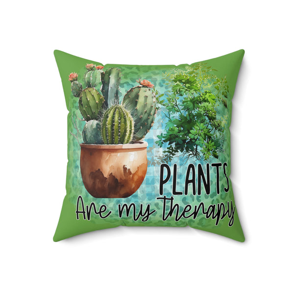 Decorative pillow with cactus design and 'Plants are my therapy' text on a green background