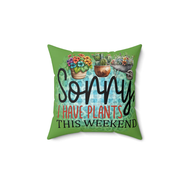 Green pillow with plant-themed text and illustrations on a white background