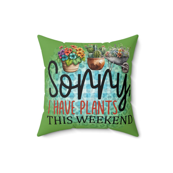Green pillow with plant-themed text and illustrations on a white background