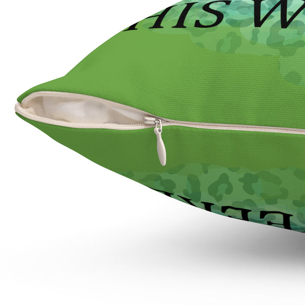 Green pillow with text and pattern on a white background