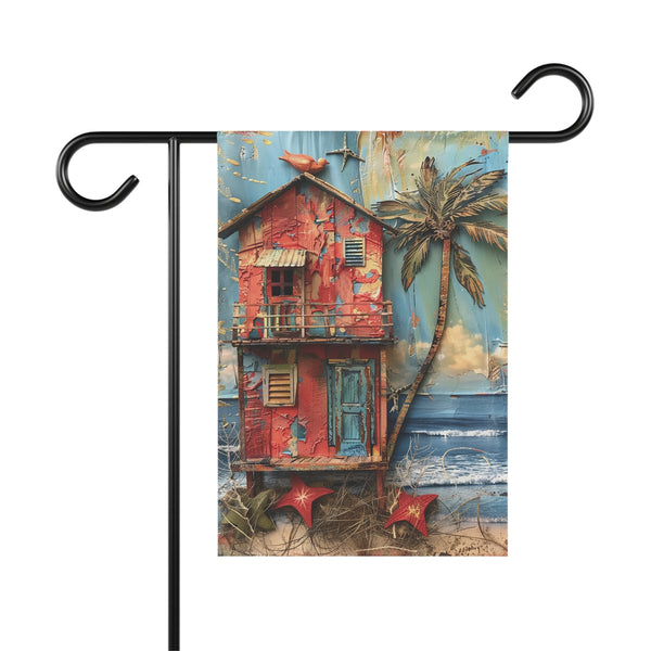 Decorative garden flag with a red beach hut and palm tree design on a white background.
