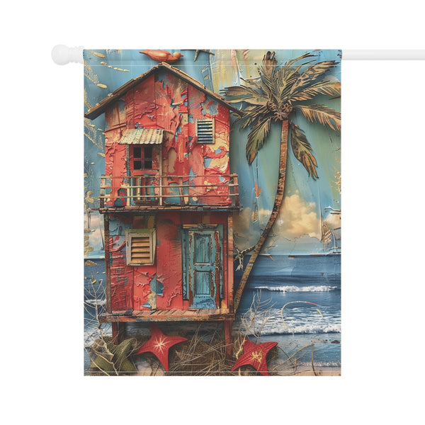 Decorative flag with a colorful beach scene featuring a red house, palm tree, and ocean.