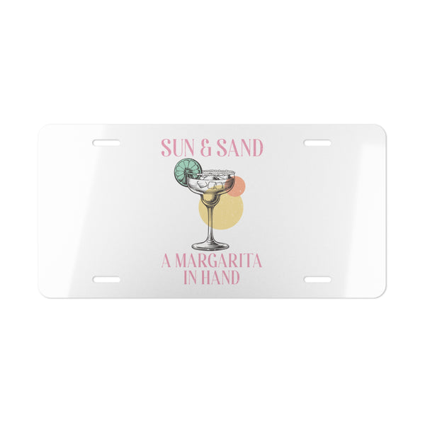 License plate with a margarita design and text 'Sun & Sand, A Margarita In Hand' on a white background
