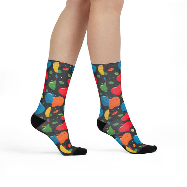 Colorful fruit-patterned socks on a plain background