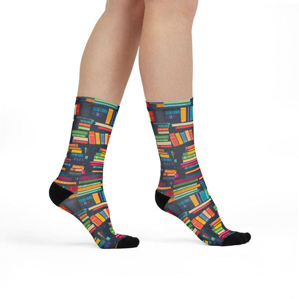 Colorful book-patterned socks on a white background