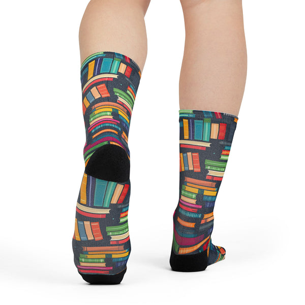 Colorful patterned socks worn by a person on a white background