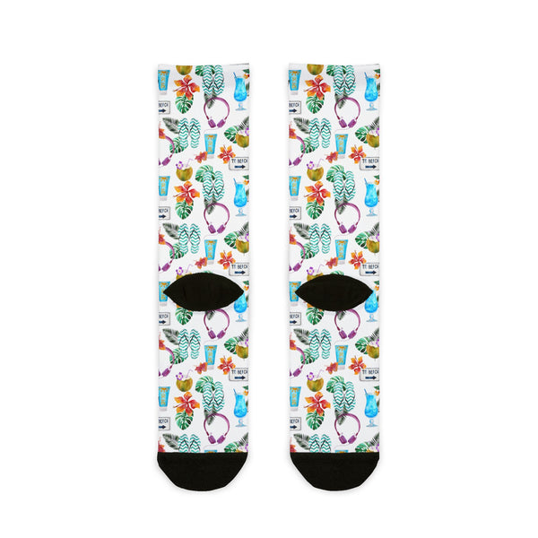 Colorful socks with floral and cup patterns on a white background