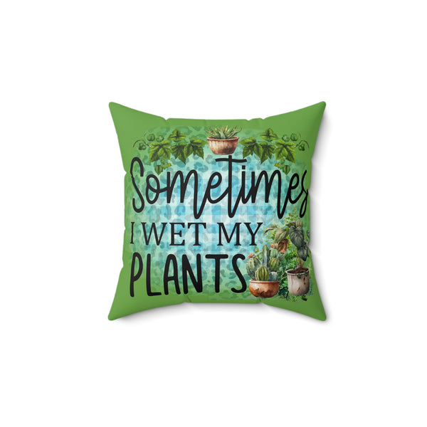 Green pillow with plant illustrations and text 'Sometimes I wet my plants' on a white background
