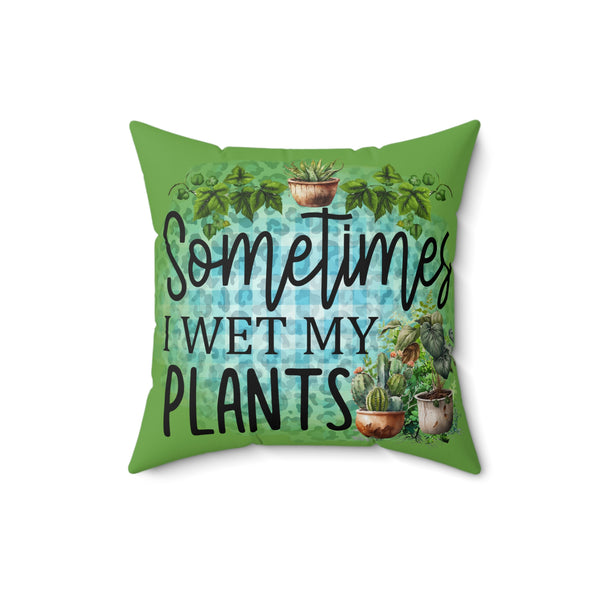 Green pillow with plant-themed design and text 'Sometimes I wet my plants' on a white background