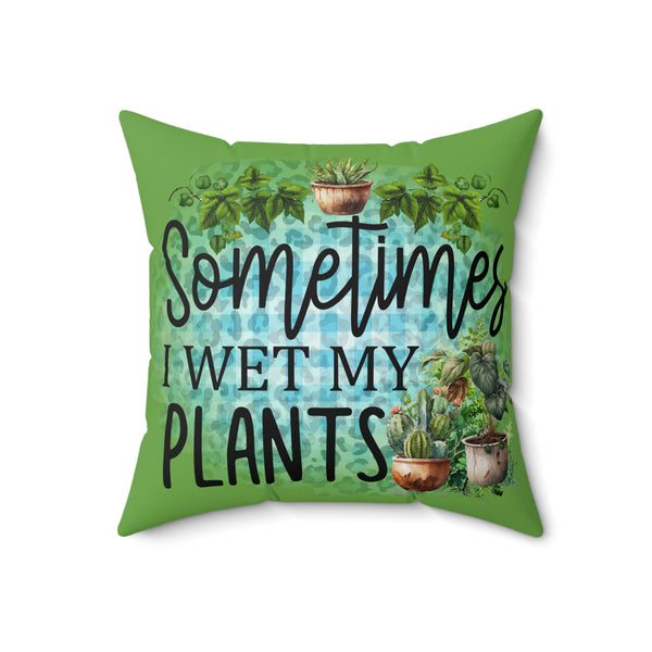 Green pillow with plant-themed design and text 'Sometimes I wet my plants' on a white background