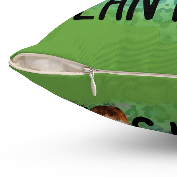 Green pillow with a zipper on a white background