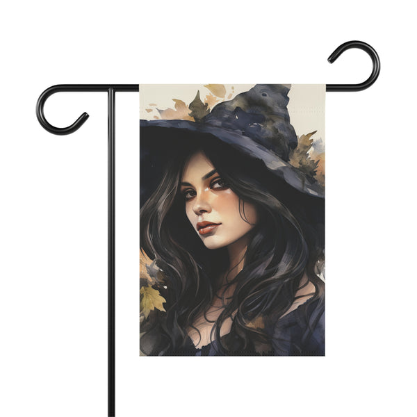 Decorative garden flag with a witch design on a white background