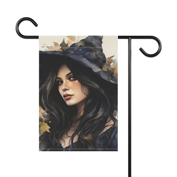Decorative garden flag with a witch design on a white background