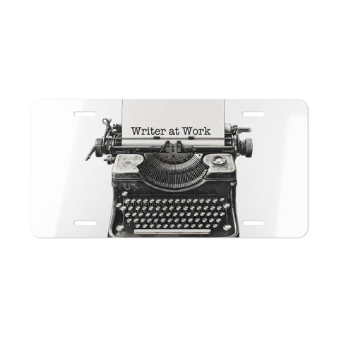 License plate with a vintage typewriter design and 'Writer at Work' text on a white background