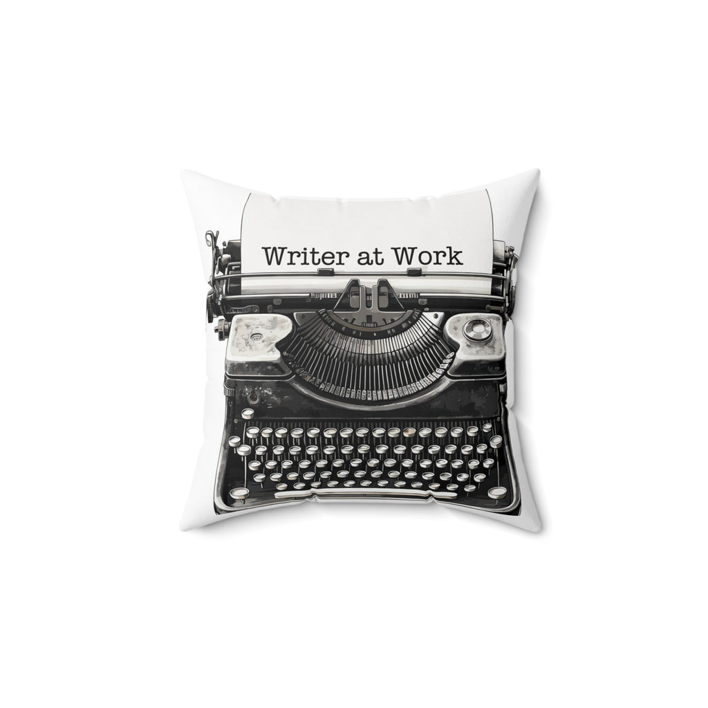 Decorative pillow with a typewriter design and 'Writer at Work' text on a white background