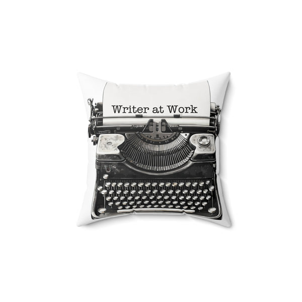 Decorative pillow with a typewriter design and 'Writer at Work' text on a white background