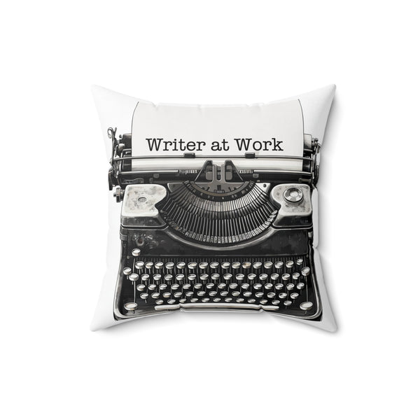 Decorative pillow with a typewriter design and 'Writer at Work' text on a white background