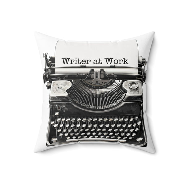Decorative pillow with a vintage typewriter design and 'Writer at Work' text on a white background