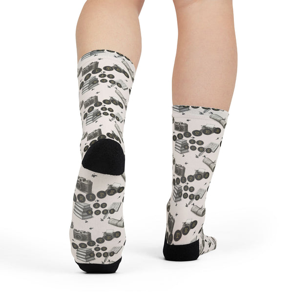 White socks with black pattern worn by a person on a white background