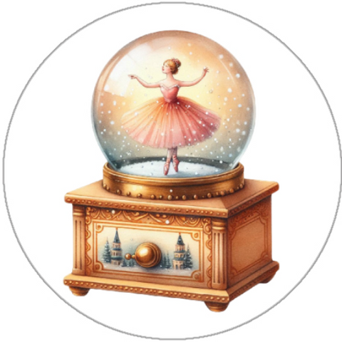 Snow globe with a ballerina inside on a wooden base