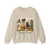 Beige sweatshirt with Halloween-themed design featuring a cat, pumpkin, and ghost on a white background.