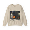 Beige sweatshirt with Halloween design featuring ghosts and pumpkins on a white background