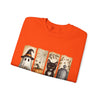 Folded orange t-shirt with Halloween-themed design on a white background
