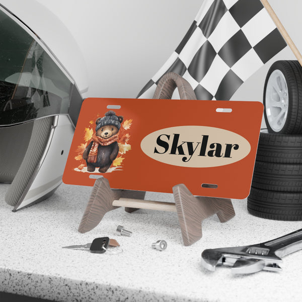 Baby Black Bear Custom Front License Plate with Personalization panel  on display on a shelf