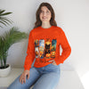 Person wearing an orange sweatshirt with Halloween-themed design sitting on a white surface.