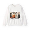 White sweatshirt with Halloween-themed design featuring a pumpkin, black cat, and ghost with text 'Spooky Season' on a white background.