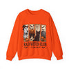 Orange sweatshirt with Halloween-themed design and 'Bad Witch Club' text on a white background