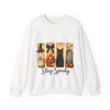 White sweatshirt with Halloween-themed design featuring a black cat, pumpkin, and scarecrow on a white background.