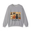 Gray sweatshirt with Halloween-themed design featuring a black cat, pumpkin, andow, and text 'Stay Spooky' on a white background.