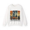 White sweatshirt with Halloween-themed design featuring pumpkins, bats, and a castle on a white background.
