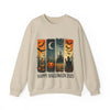Beige sweatshirt with Halloween-themed design featuring pumpkins, bats, and a castle.