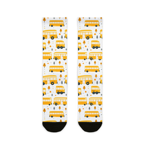 Pair of socks with yellow school bus pattern on a white background