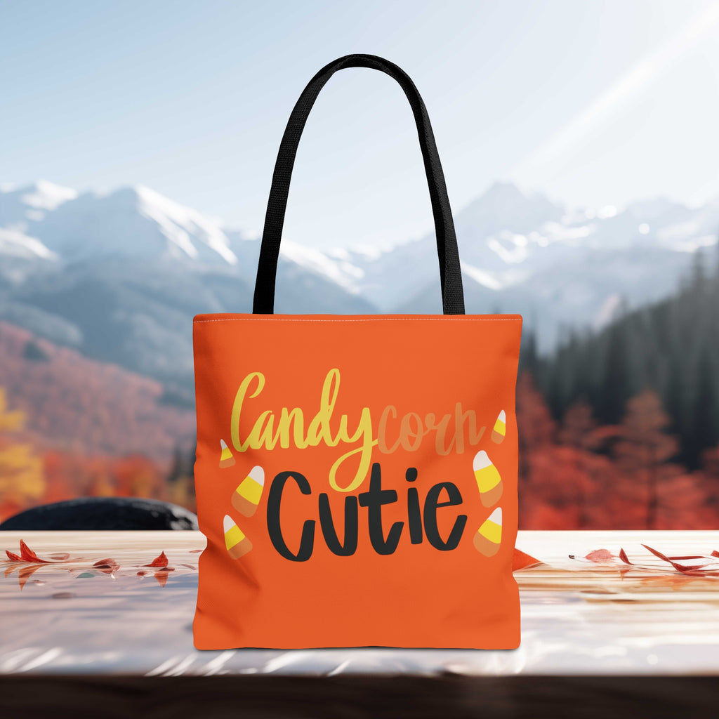 Candy Corn Cute Halloween Trick or Treat Bag sitting on a table edge with mountains in fall background