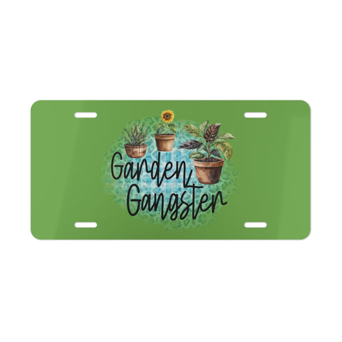 Green license plate with 'Garden Gangster' text and plant illustrations on a white background