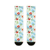 Pair of socks with ladybug and flower pattern on a white background