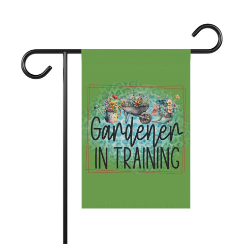Garden flag with 'Gardener in Training' text and floral design on a green background.