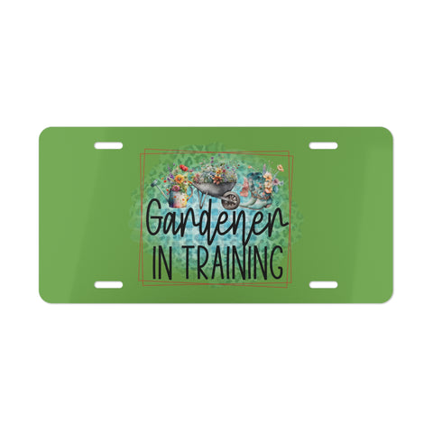 Green license plate with 'Gardener in Training' text and gardening-themed design on a white background