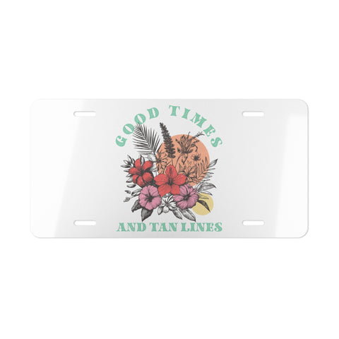 License plate with floral design and text 'Good Times and Tan Lines' on a white background