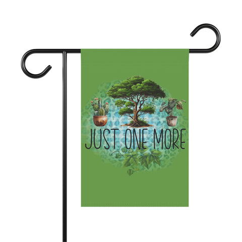 Green garden flag with a tree and plants design and 'Just One More' text on a white background.