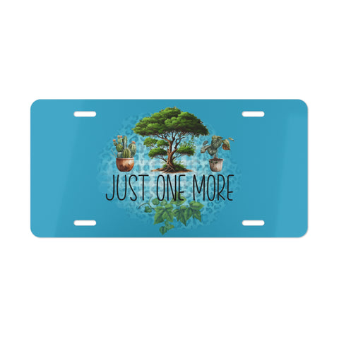 Blue license plate with plants and 'Just One More' text on a white background