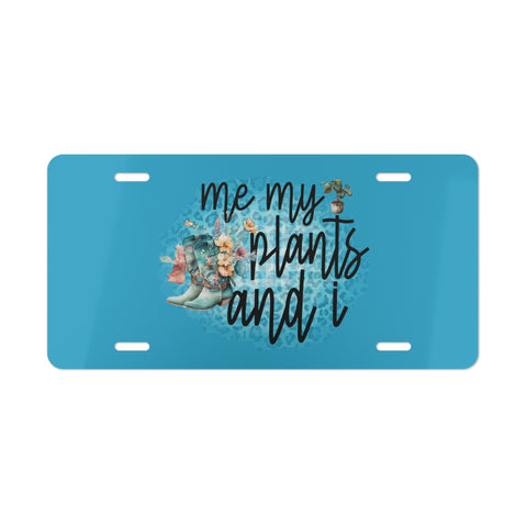 Blue license plate with 'me my plants and i' text and plant illustrations on a white background