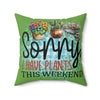 Decorative pillow with plant-themed text and images on a green background
