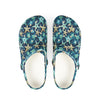 Pair of clogs with starfish pattern on a white background