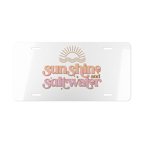 License plate with 'Sunshine and Saltwater' text and sun design on a white background